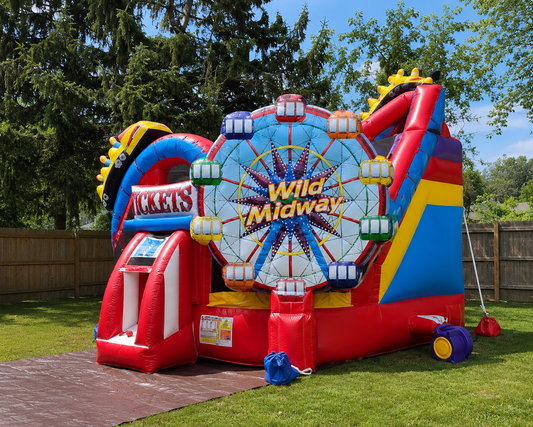 Colorful inflatable amusement park with Ferris wheel design on a grassy area.