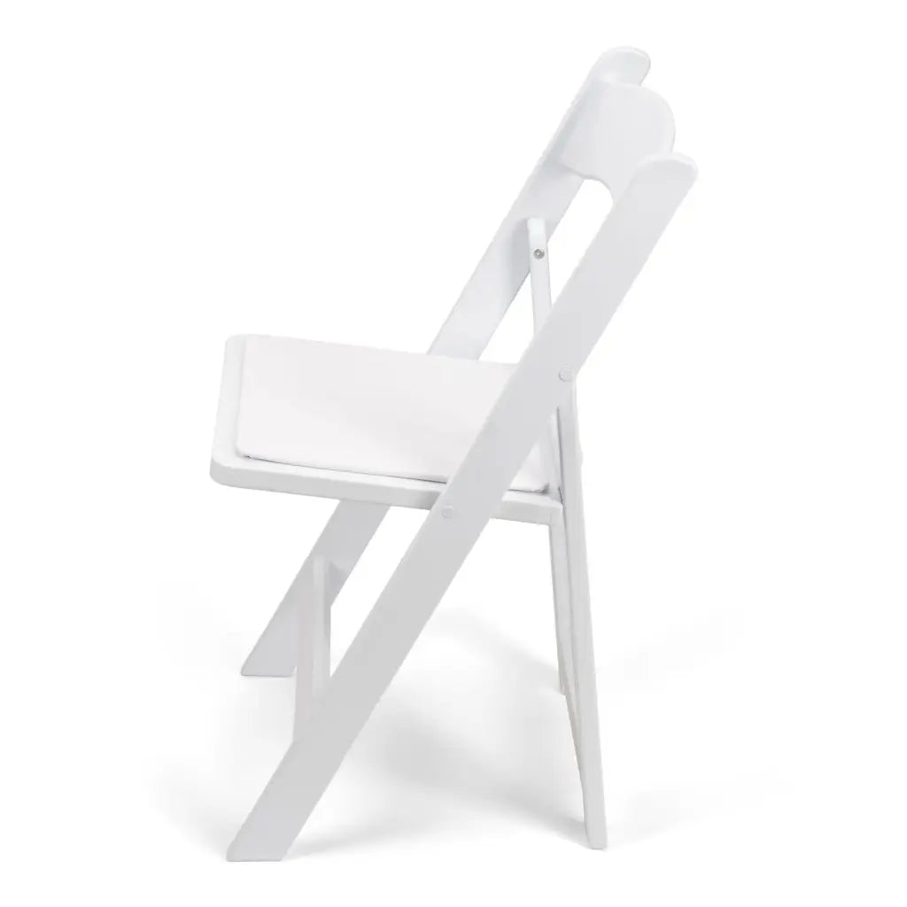 White resin folding chair with a padded seat, ideal for weddings and events. Lightweight, durable, and elegant, perfect for any venue.